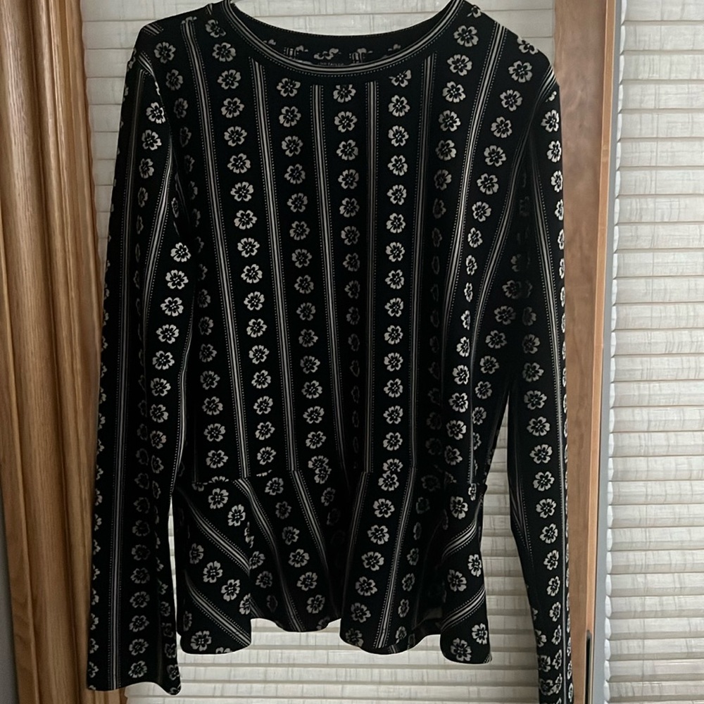 Playful vertical striped knit black with tan flowered Peplum shirt.